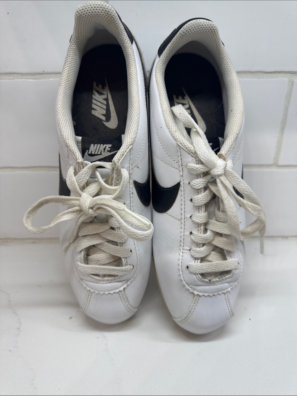Nike Women’s White Sneakers with Black Swoosh